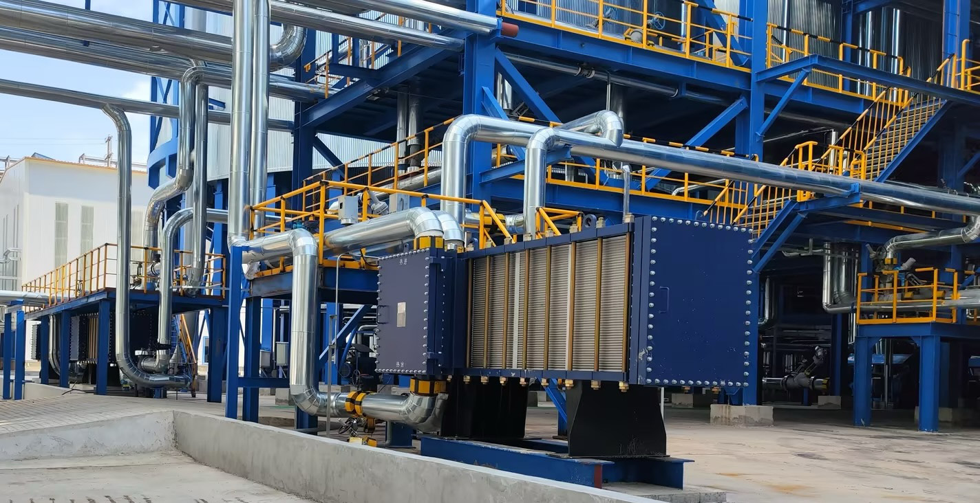 Wide gap welded plate heat exchanger in chemical process service