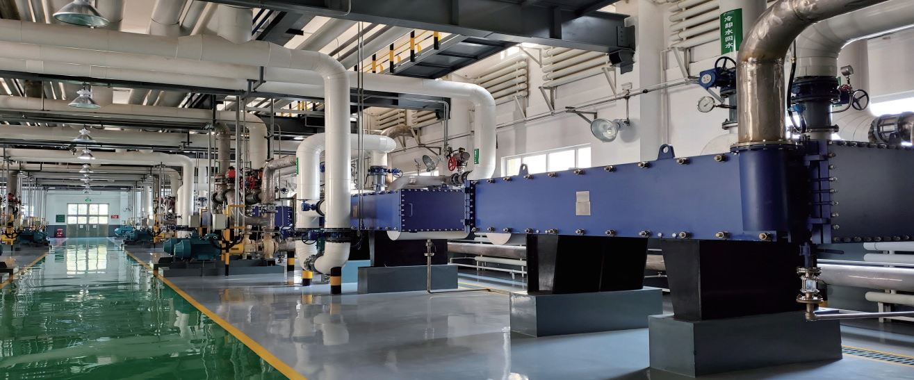 Wide gap welded plate heat exchanger in fuel ethanol production